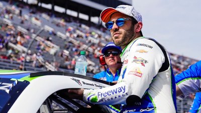 Nascar Racer Daniel Suárez entering his race car at NASCAR